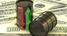 barris de petróleo sobre notas de dólar